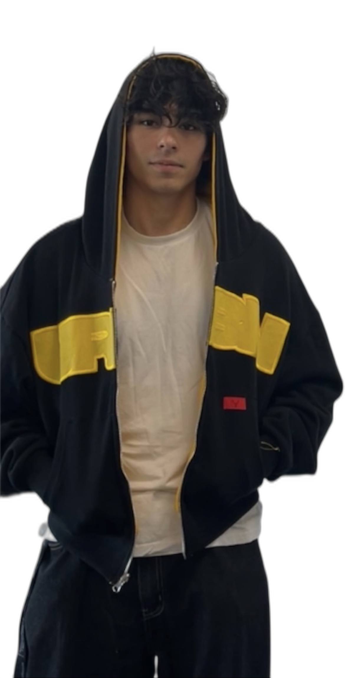 Person wearing the black and yellow REVERSO zip-up hoodie